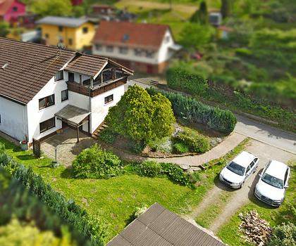Vielseitig nutzbares Einfamilienhaus mit vermieteter Einliegerwohnung in idyllischer Odenwaldlage
