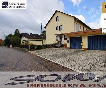 Attraktives Zweifamilienhaus mit zwei Garagen aus einem großzügigen Grundstück - Ein Objekt von Ihrem Immobilienpartner SOWA Immobilien und Finanzen