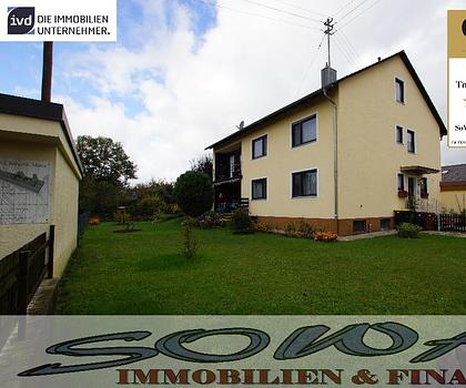 Schönes Zweifamilienhaus mit zwei Garagen aus einem großzügigen Grundstück - Ein Objekt von Ihrem Immobilienpartner SOWA Immobilien und Finanzen