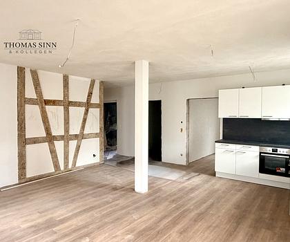 Charmante 3,5-Zimmer Hochparterre-Wohnung mit Terrasse & Fachwerkflair im kernsanierten Denkmal